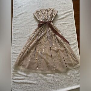 Blush sequined knee length summer wedding guest dress or special occasion.